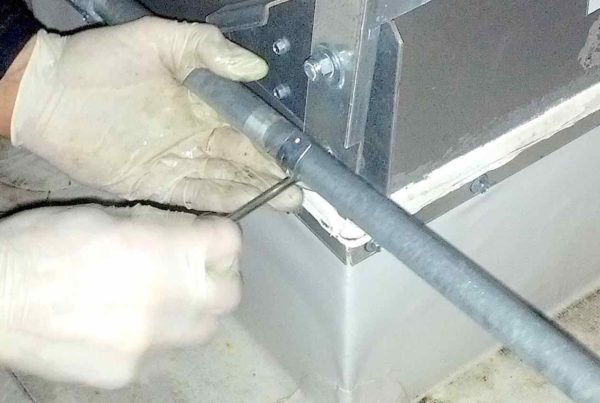 Installing a hinge kit on an exhaust fan in Dallas, TX