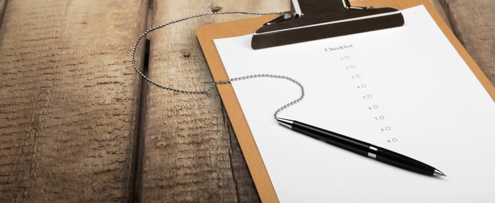 Image of clipboard with checklist and pen