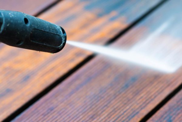 Pressure washing a wooden deck